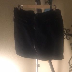 Black skirt. Zipper in the front.